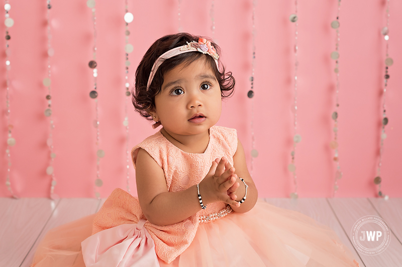 first birthday baby girl pink dress silver curtain Kingston children photographer