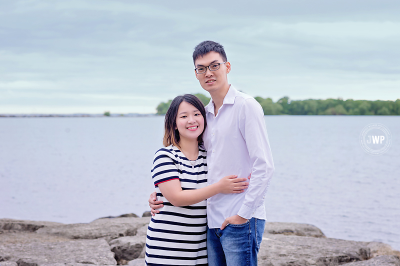 husband wife on rocks lake ontario park Kingston family photographer