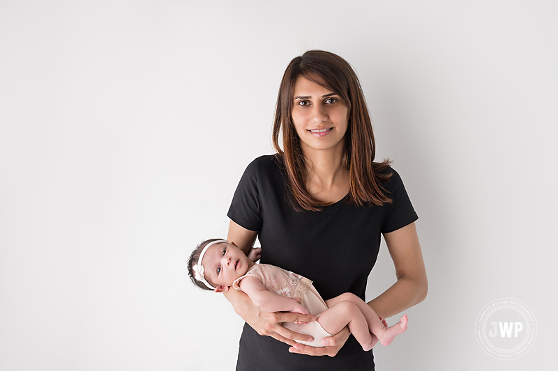 mother holding daughter in arms Kingston Photographer