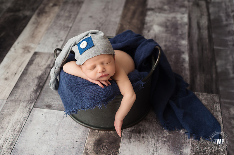 newborn baby boy grey wood floor blue scarf Kingston newborn photographer