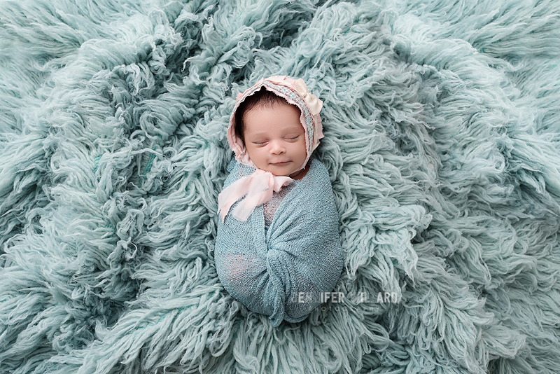 newborn baby girl posed portrait blue flokati kingston ontario photographer