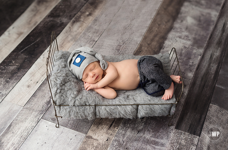 newborn boy grey pants wire bed Kingston newborn photographer