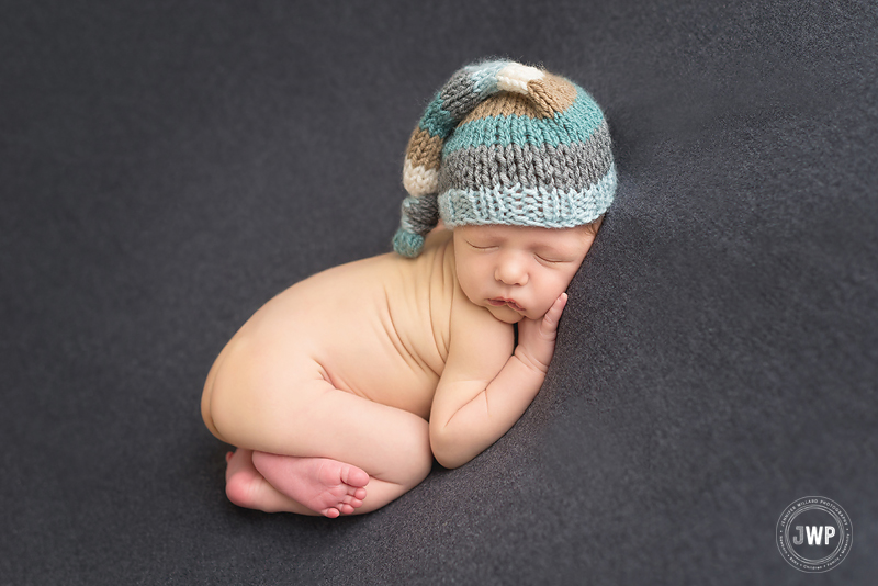 newborn boy striped hat grey blanket Kingston baby photographer