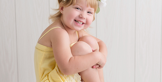 toddler girl yellow dress flower crown white backdrop Kingston children photographer