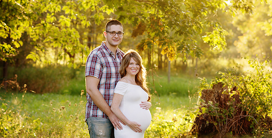 pregnant mother husband golden hour field white dress Kingston maternity photographer