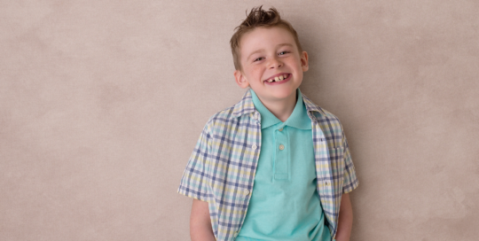 boy in blue shirt with big smile Kingston children photographer