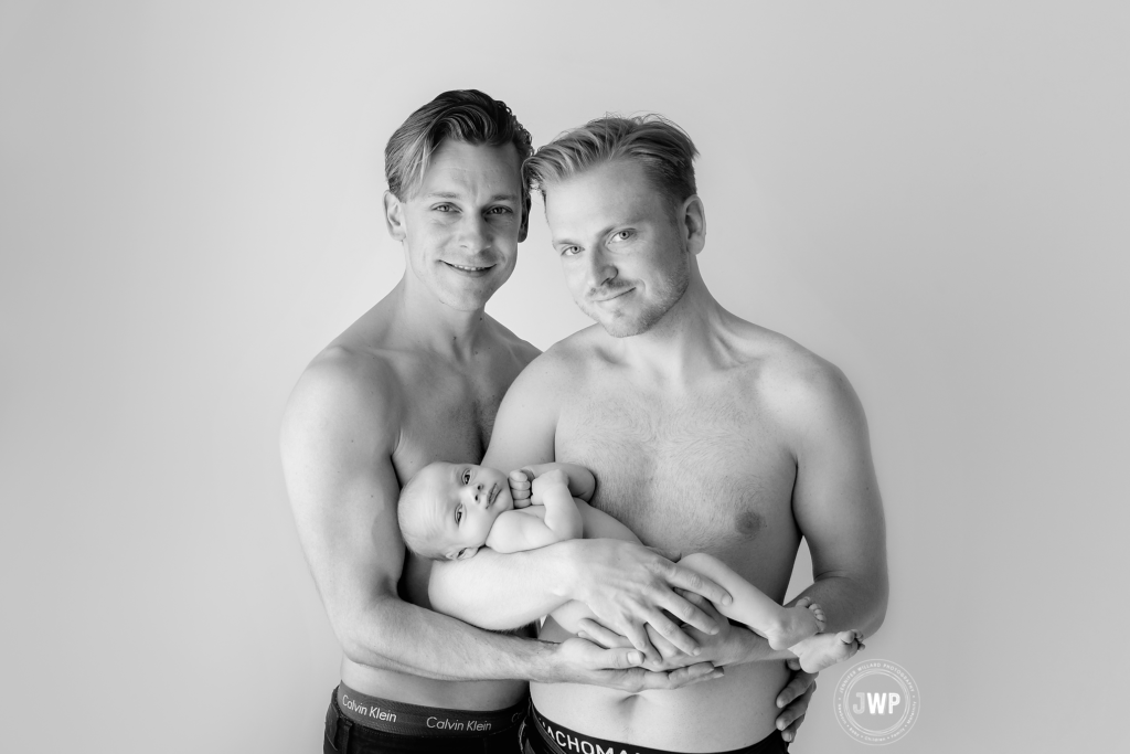 Baby in Father's arms in black and white by Kingston LGBTQ Photographer 