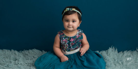 6 month old baby girl teal backdrop dress Kingston baby photographer