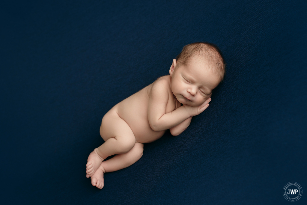 baby boy blue blanket side laying down Kingston ontario photographer