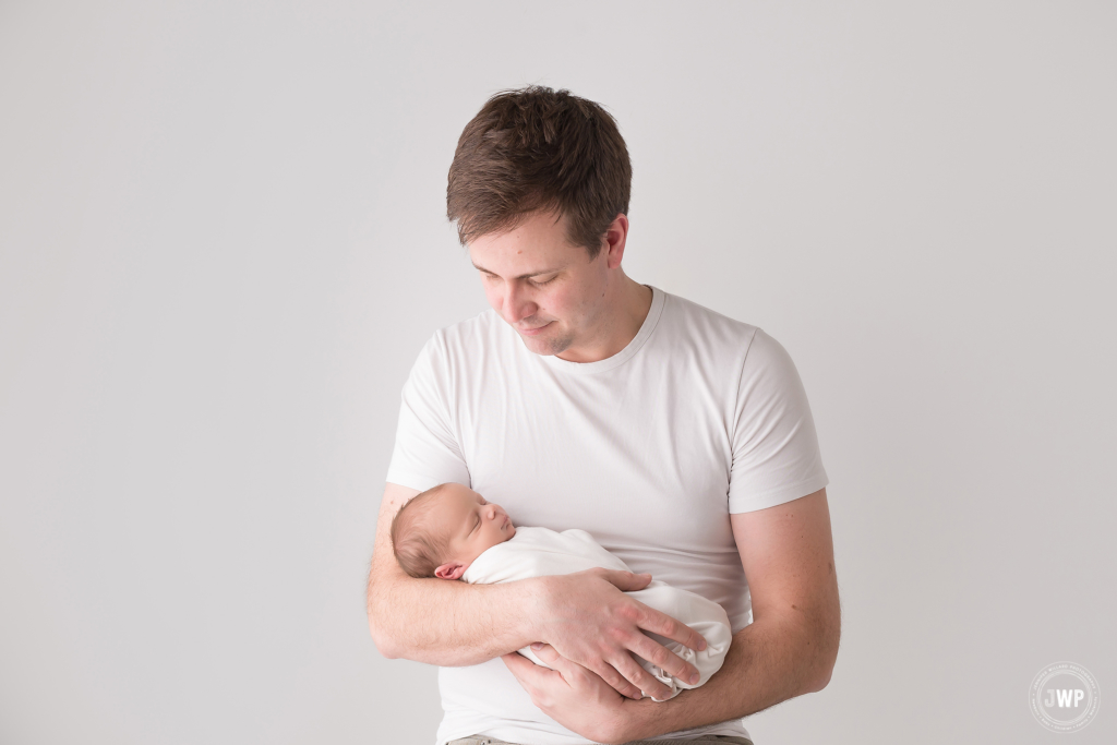 baby boy white wrap father Kingston ontario newborn photographer