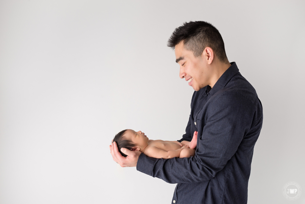 baby girl Fathers arms Kingston newborn photography