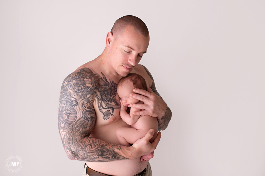 baby in Dads arms on chest Kingston newborn photographer