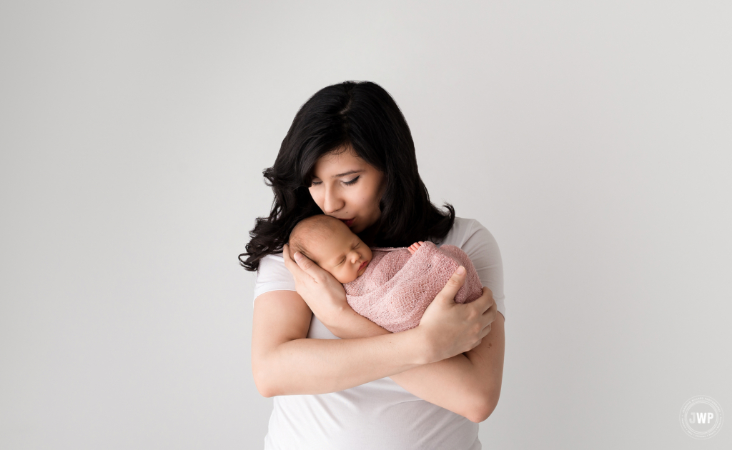 mom kissing baby girl Kingston newborn photographer