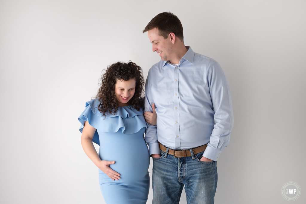 pregnant mother blue dress father laughing Kingston maternity photographer