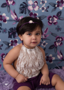 purple blue flower backdrop lace romper Kingston first birthday photographer