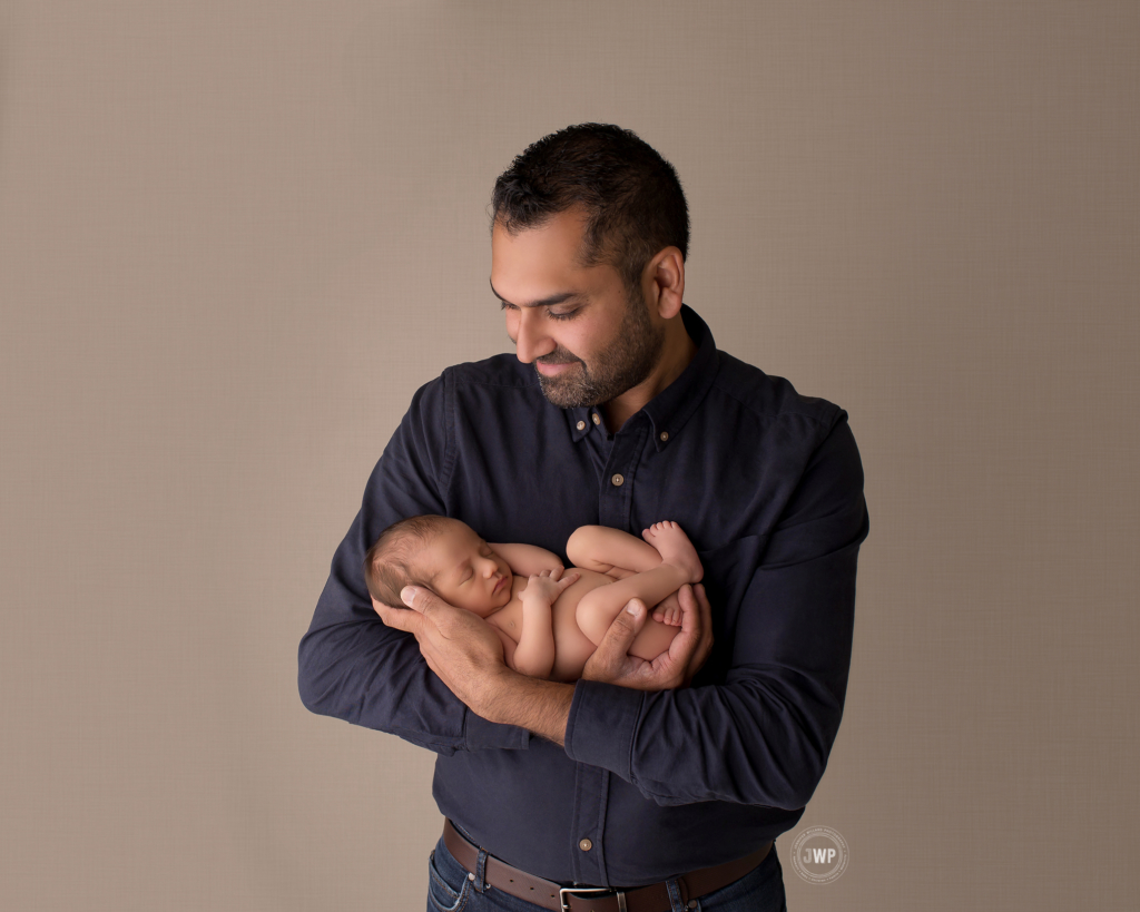 baby boy fathers arms Kingston newborn photographer