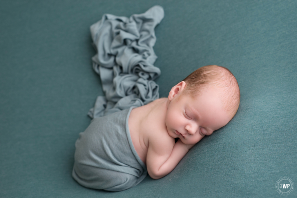 newborn baby on blue blanket Kingston family photographer