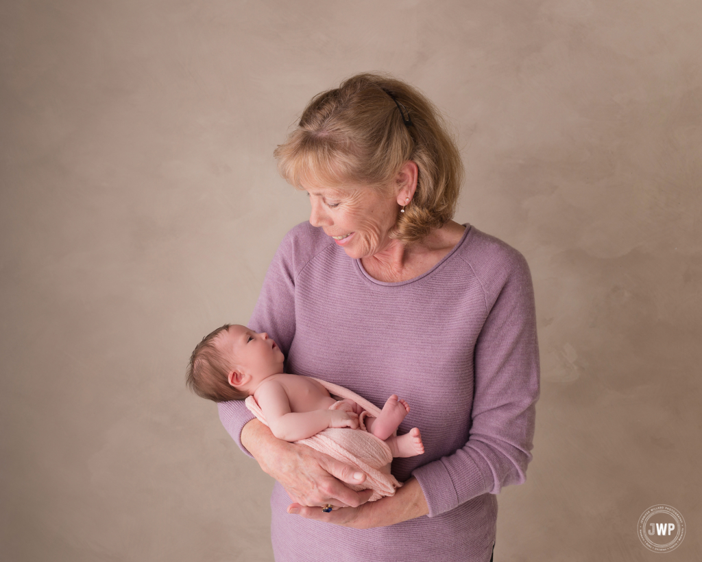 Grandmother baby portraits pink wrap purple sweater Kingston Studio