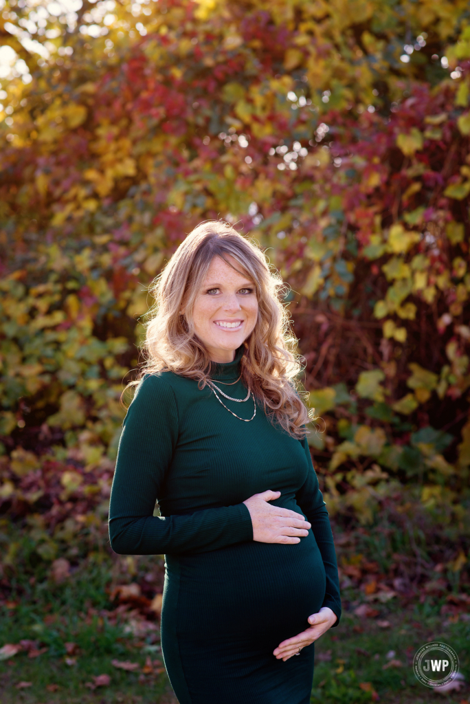 Pregnant Mother green dress golden light Fall leaves Kingston Maternity Photographer