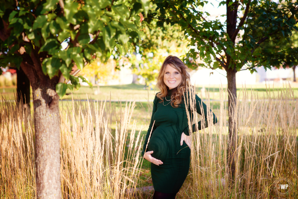 Pregnant Mother green dress sunlight long grass Kingston Maternity Photographer