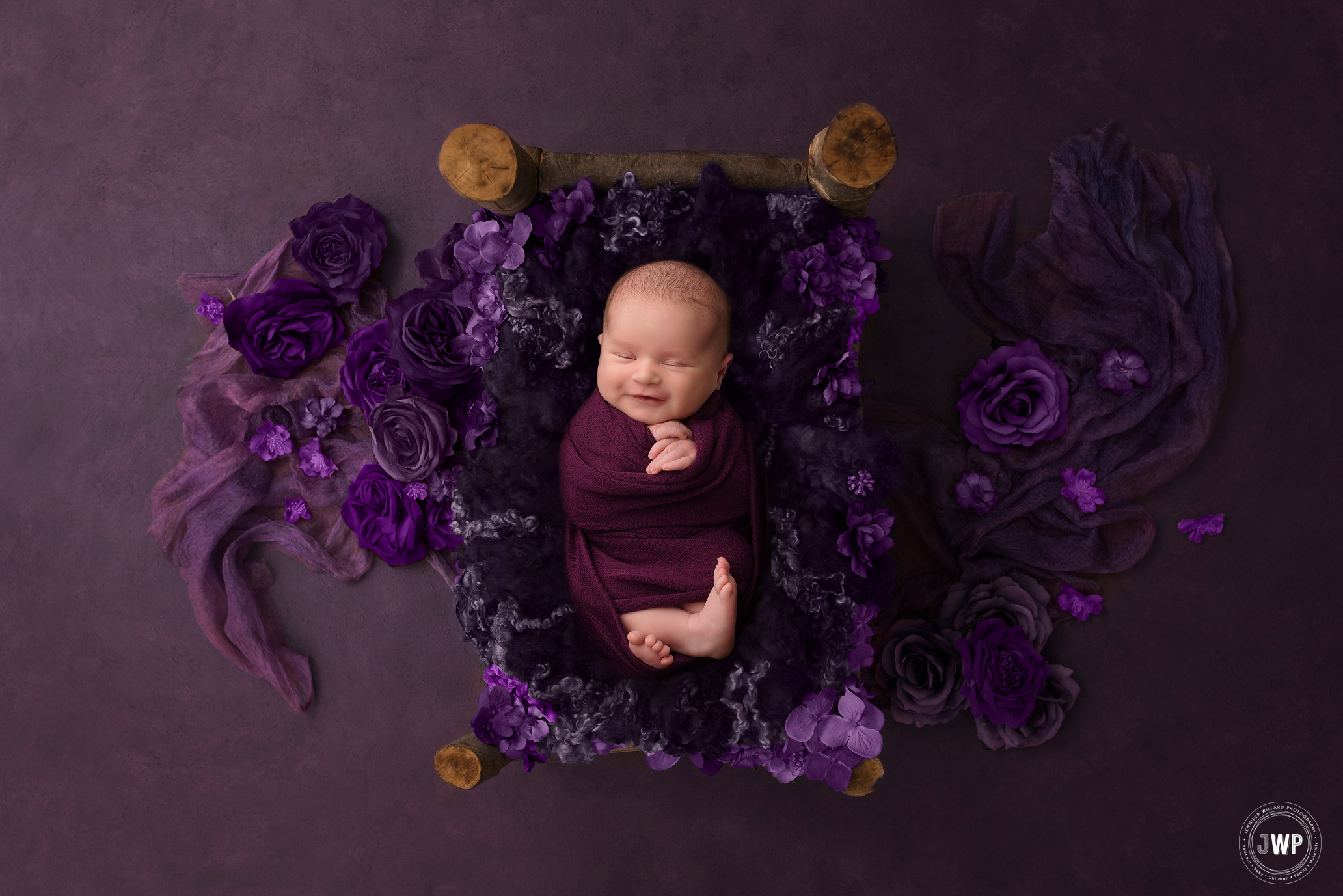 baby girl purple flowers bed APNPIMember Brockville newborn photographer