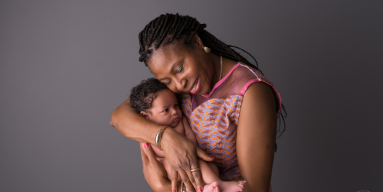 African American Mother newborn boy grey backdrop Kingston baby photographer