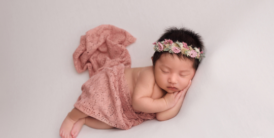 baby girl white blanket pink wrap flower headboard Kingston newborn photographer