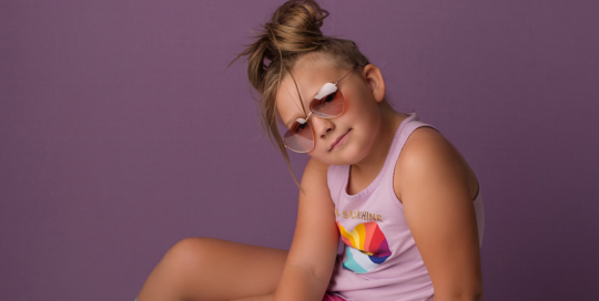 girl skateboard sunglasses studio purple backdrop editorial Kingston fine art photographer