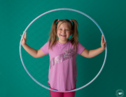 girl hula hoop green backdrop Kingston family photographer