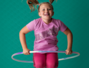 girl jumping hula hoop green purple Kingston children photographer