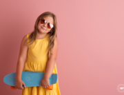 girl skateboard sunglasses pink studio backdrop Kingston portrait artist