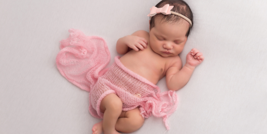 newborn girl pink wrap white blanket Kingston baby photographer