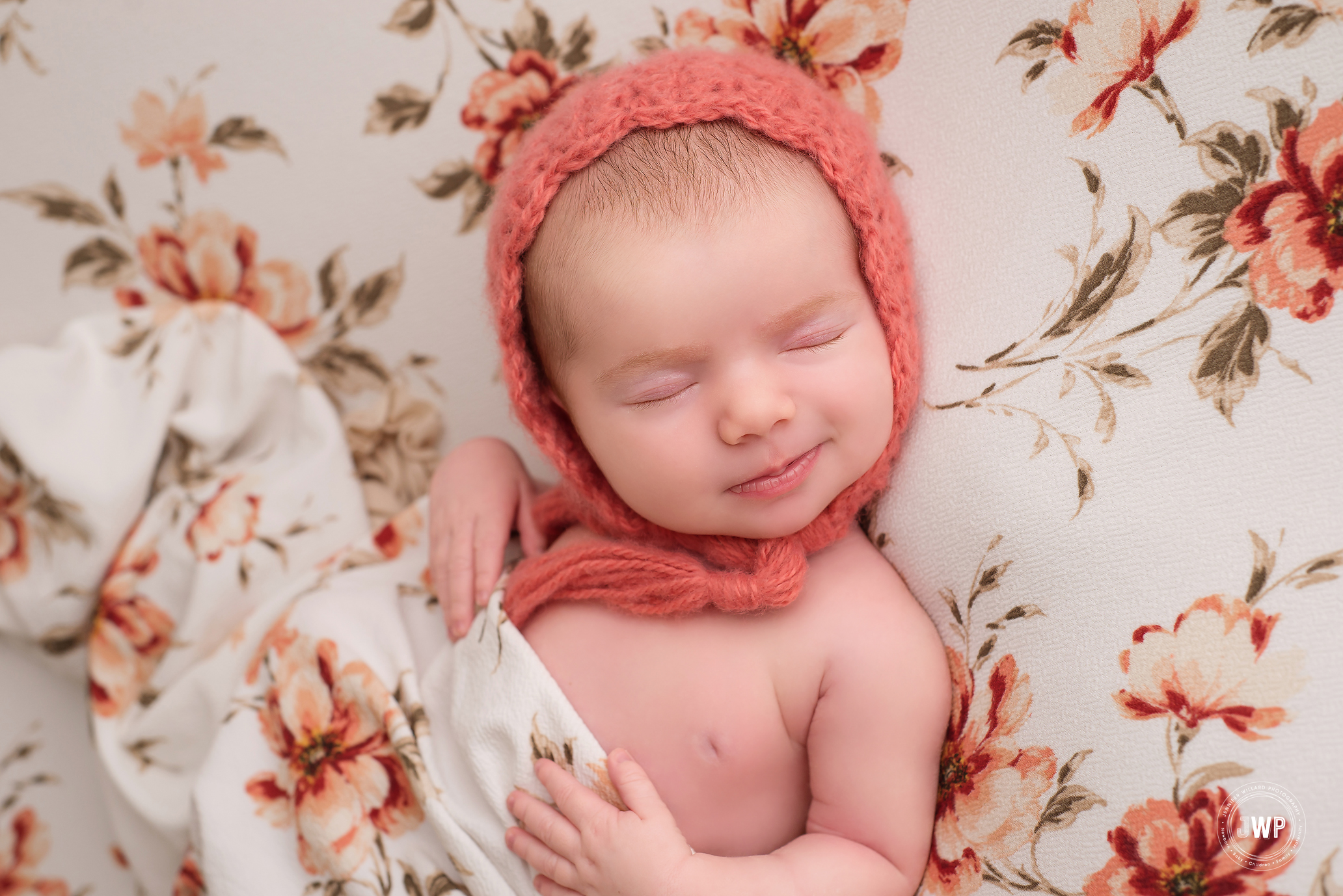 newborn girl coral bonnet flower blanket Belleville baby photographer