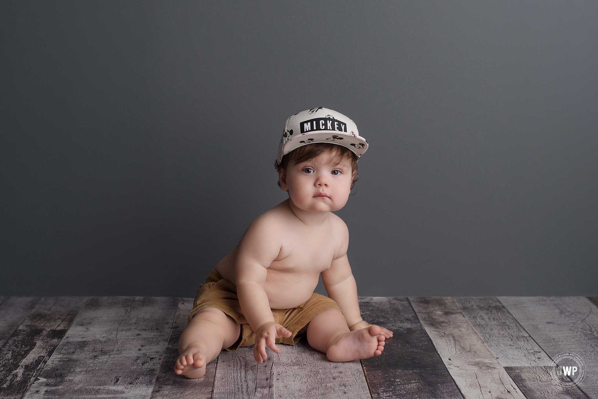 baby boy grey backdrop Mickey Mouse hat Kingston first birthday Photographer