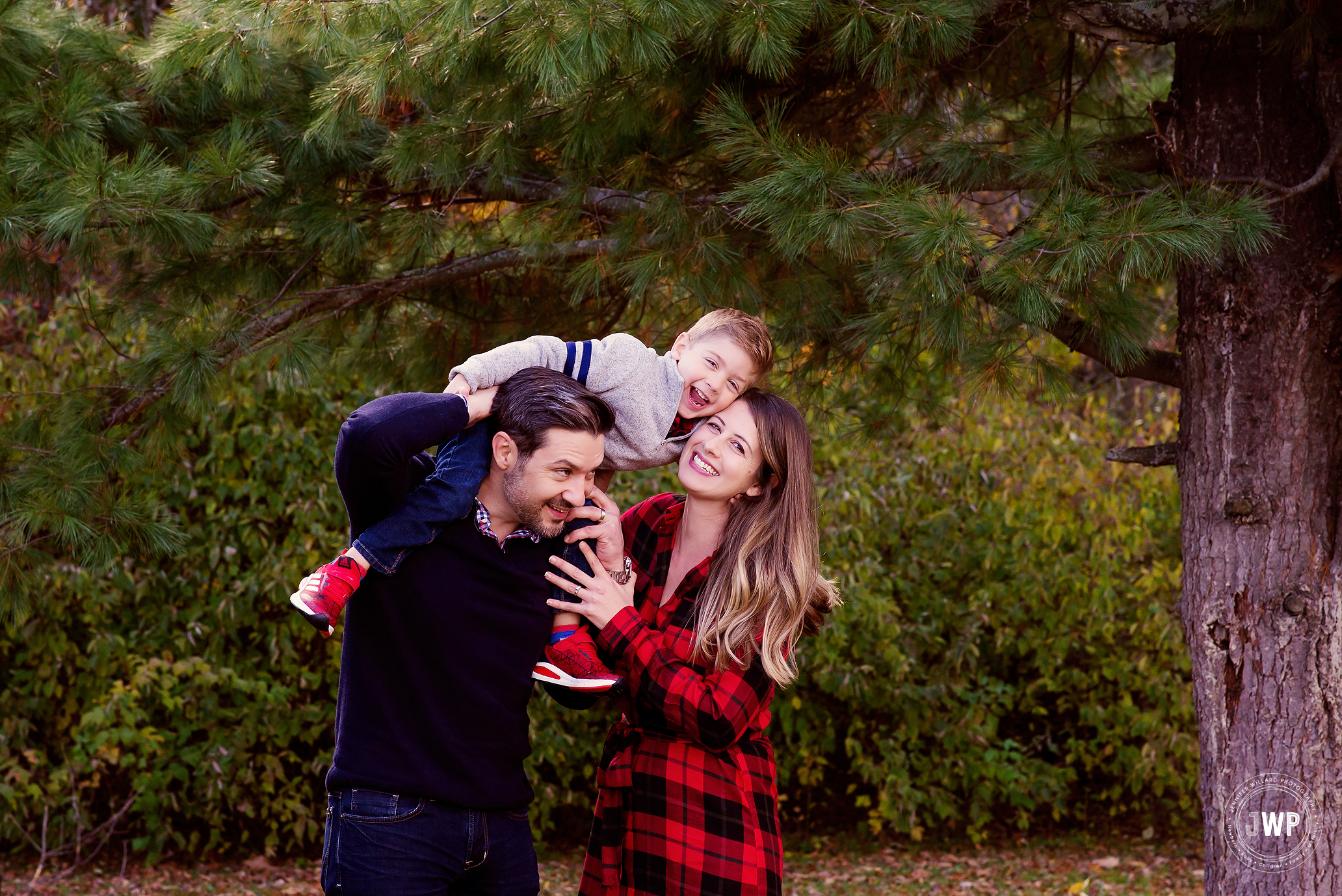 Family laughing Fall leaves Kingston Ontario Photography