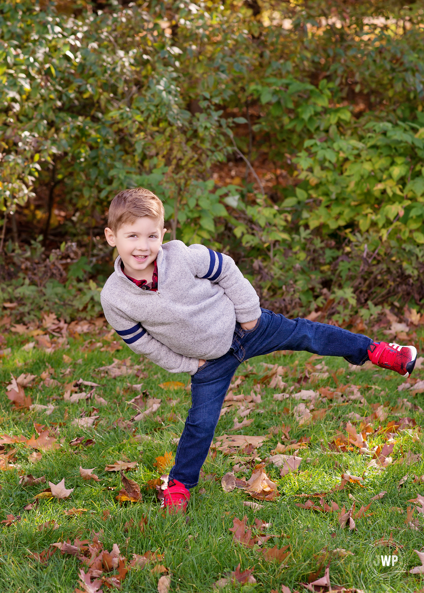 boy having fun Fall leaves Kingston children Photographer
