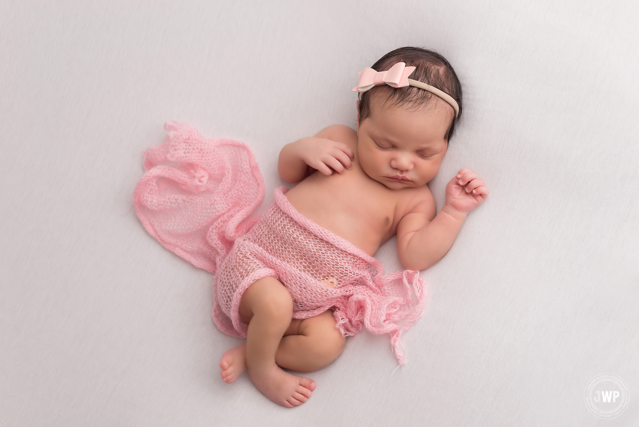 newborn girl pink wrap white blanket Kingston baby photographer