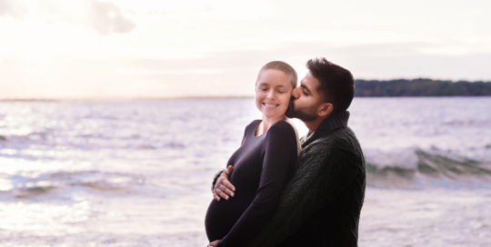 pregnant mother father Lake Ontario shoreline Kingston Maternity Photographer