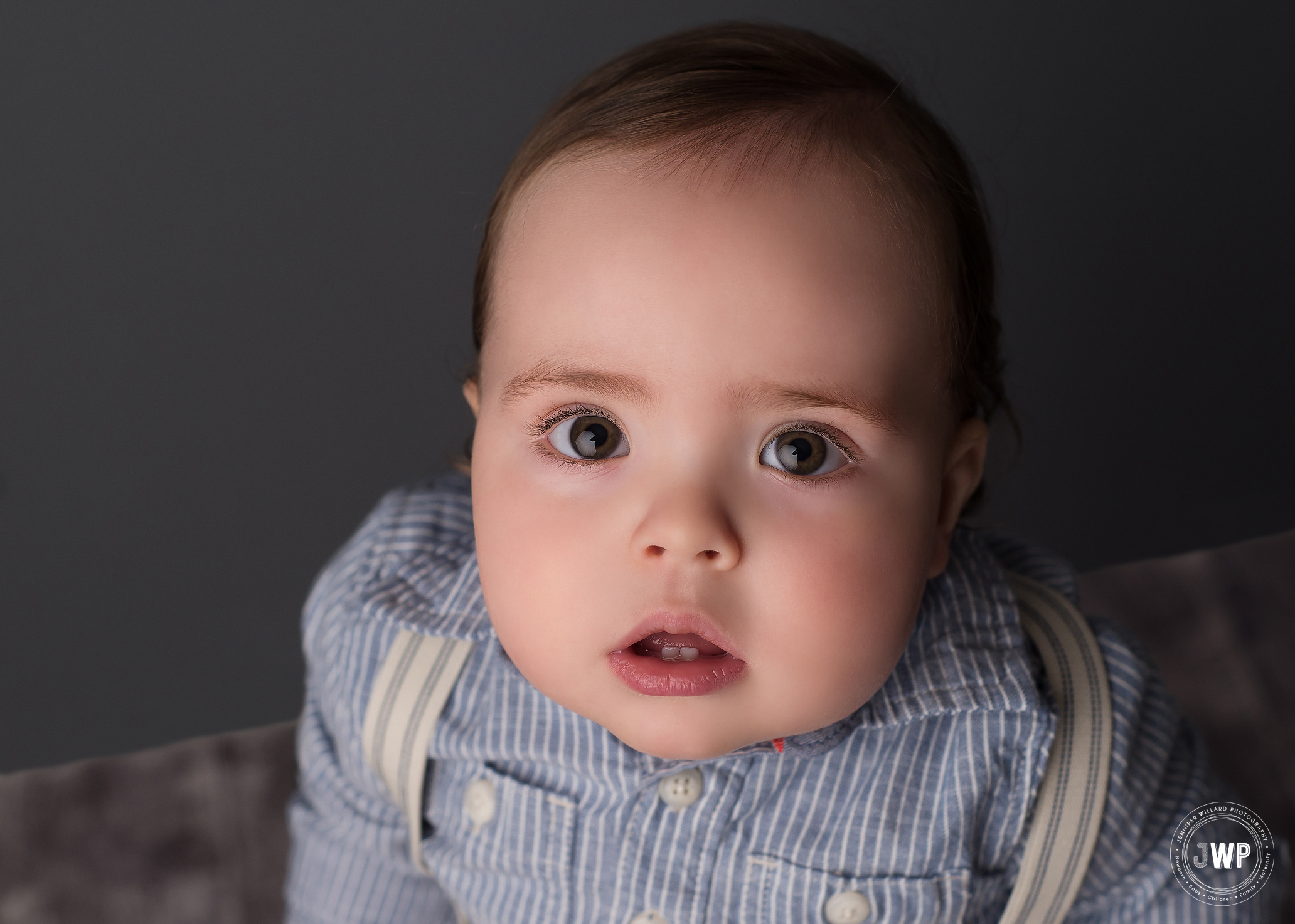 First Birthday Boy blue shirt suspenders grey backdrop Kingston Baby Photographer