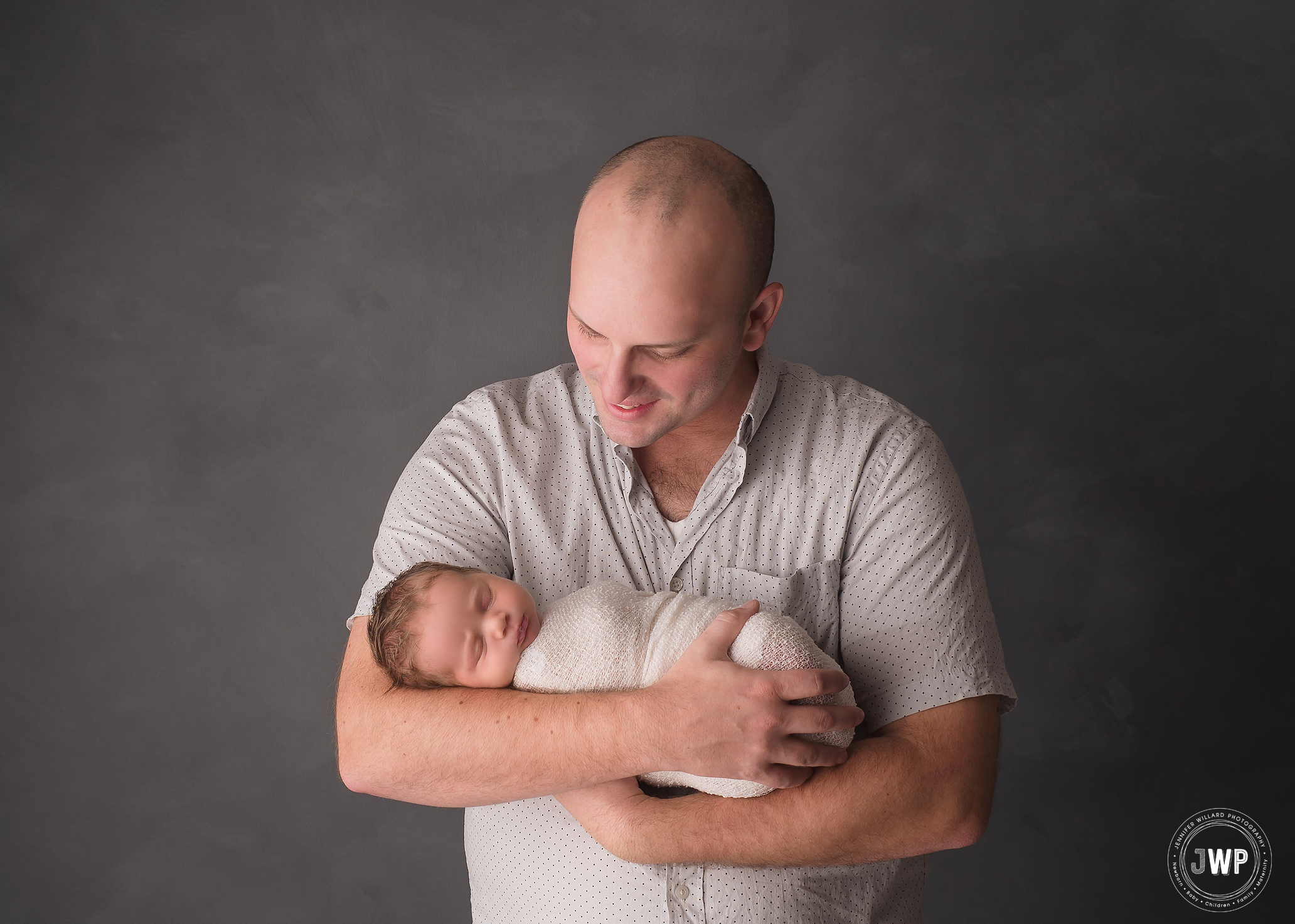 baby girl wrapped grey backdrop Father Kingston family photographer
