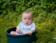 baby boy outside teal bucket Kingston portrait photographer