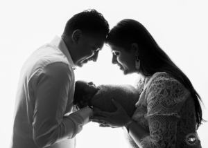 mom dad newborn baby black white backlit Kingston photographer