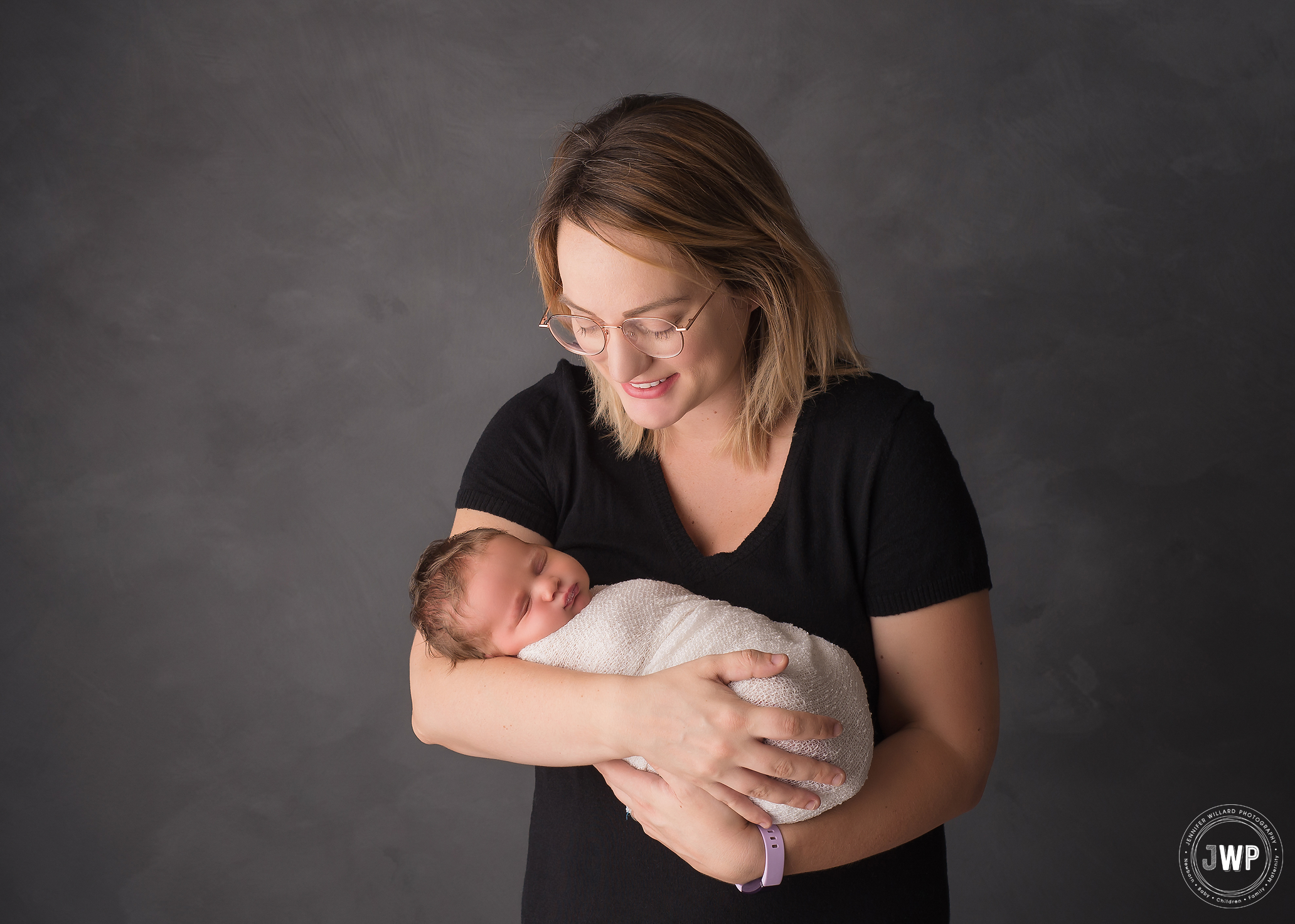 newborn girl wrapped Mothers arms Kingston family photographer