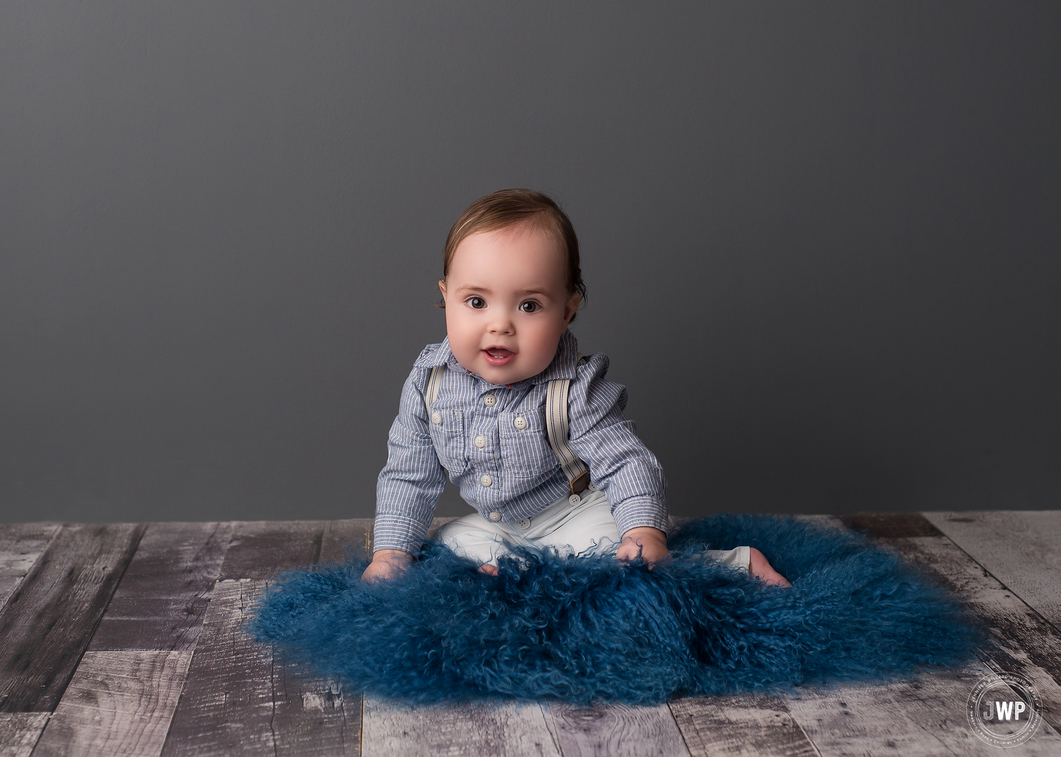 smiling baby boy birthday milestone grey backdrop Kingston Ontario Photographer