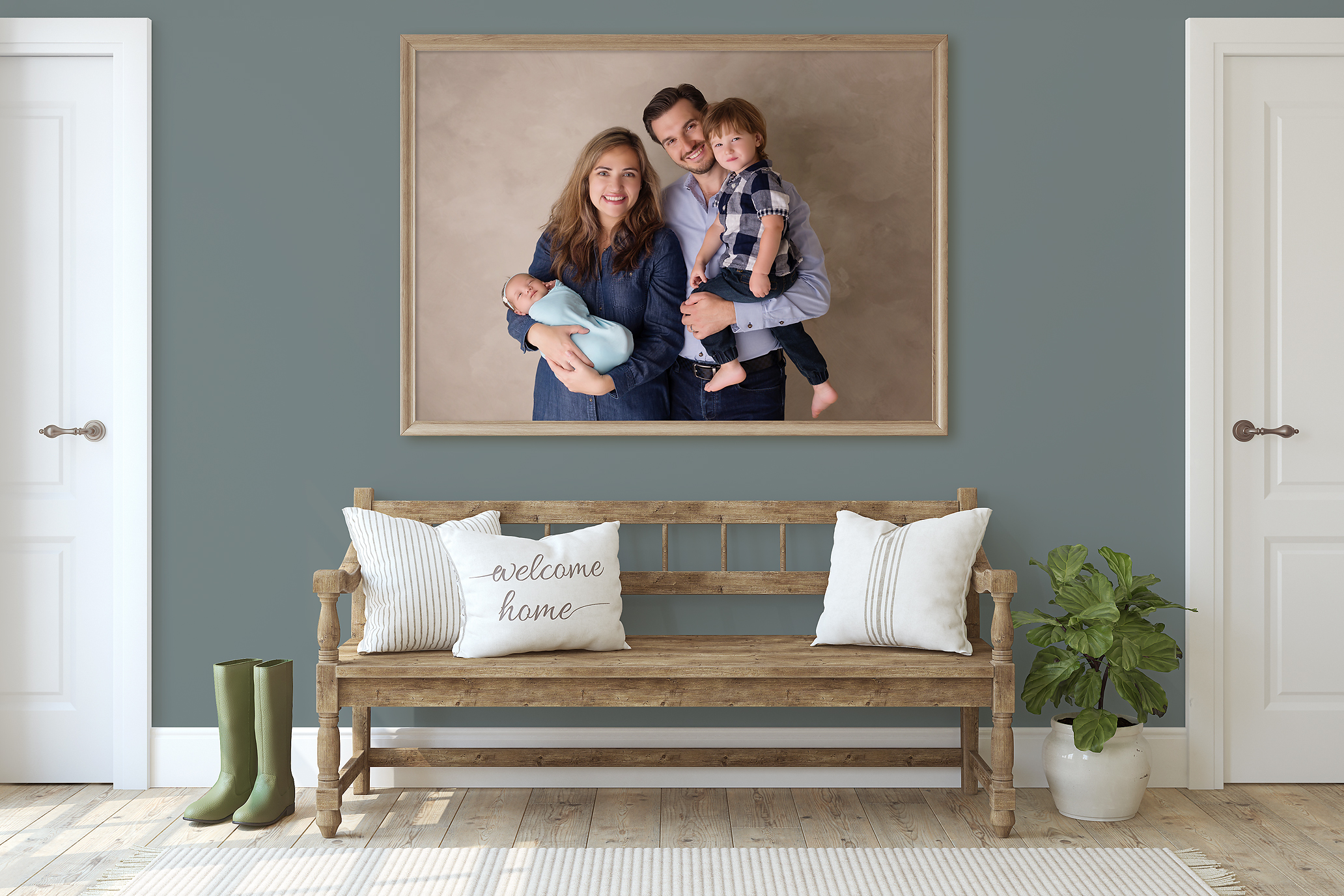 newborn family portrait in a frame in hallway above bench