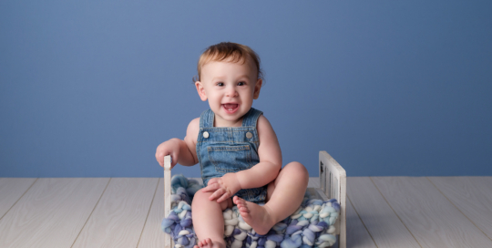 baby boy blue backdrop bed overalls Kingston baby photographer