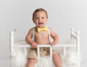 first birthday baby boy yellow bowtie crib Kingston birthday photographer